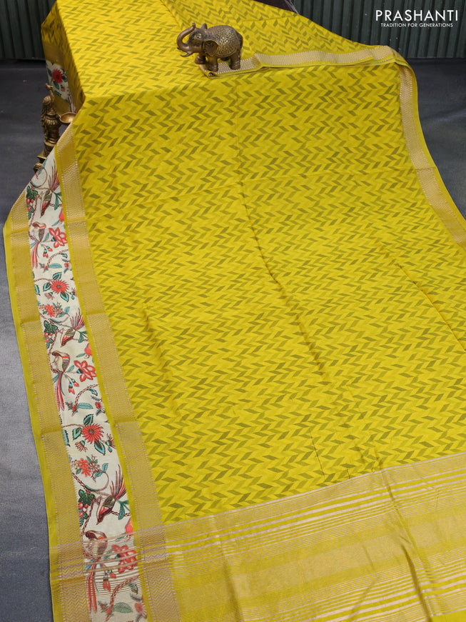 Muslin silk saree yellow and pale yellow with allover prints and rettapet zari woven printed border