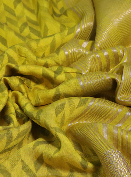 Muslin silk saree yellow and pale yellow with allover prints and rettapet zari woven printed border