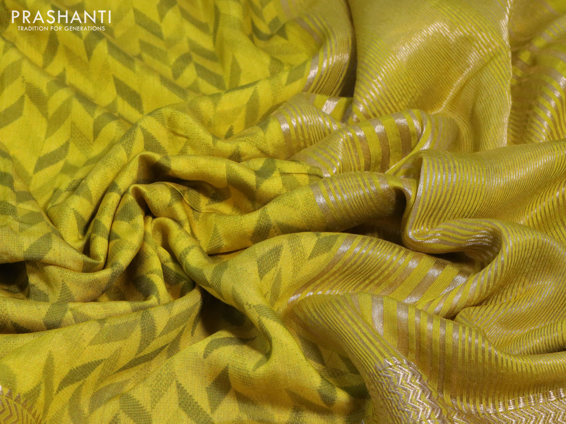 Muslin silk saree yellow and pale yellow with allover prints and rettapet zari woven printed border