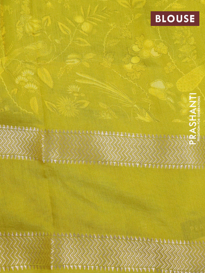 Muslin silk saree yellow and pale yellow with allover prints and rettapet zari woven printed border