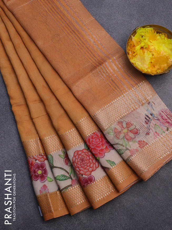 Muslin silk saree orange and cream with allover geometric prints and rettapet zari woven floral printed border