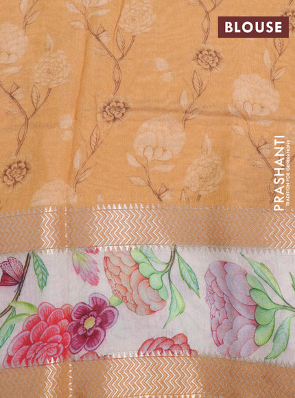 Muslin silk saree orange and cream with allover geometric prints and rettapet zari woven floral printed border