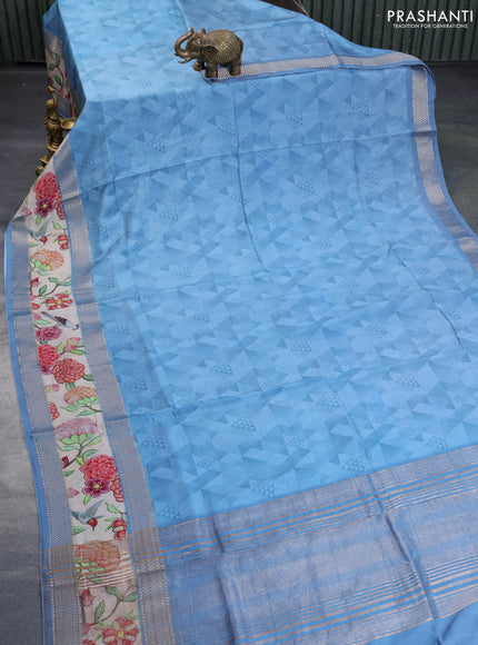 Muslin silk saree blue shade and cream with allover stripes pattern and rettapet zari woven ikat style border