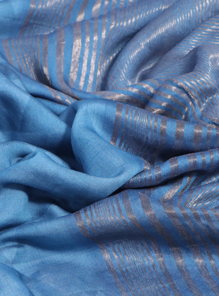 Muslin silk saree blue shade and cream with allover stripes pattern and rettapet zari woven ikat style border