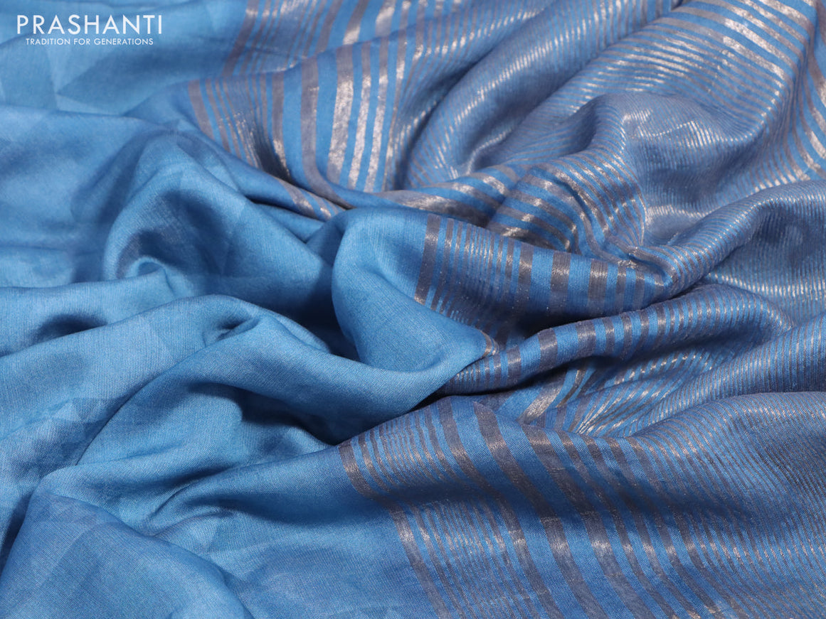 Muslin silk saree blue shade and cream with allover stripes pattern and rettapet zari woven ikat style border