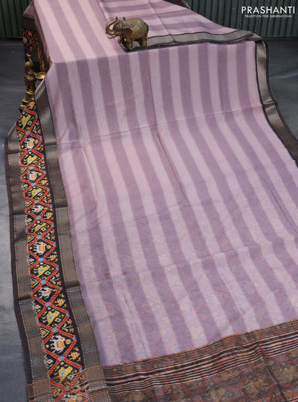 Muslin silk saree rosy brown and brown with allover stripes pattern and rettapet zari woven ikat style border