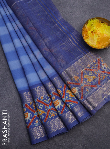 Muslin silk saree blue shade with allover stripes pattern and rettapet zari woven ikat style border