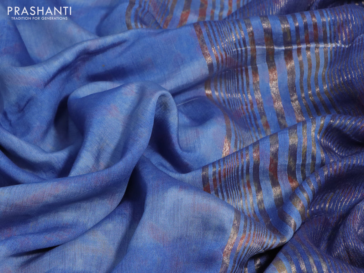 Muslin silk saree blue shade with allover stripes pattern and rettapet zari woven ikat style border