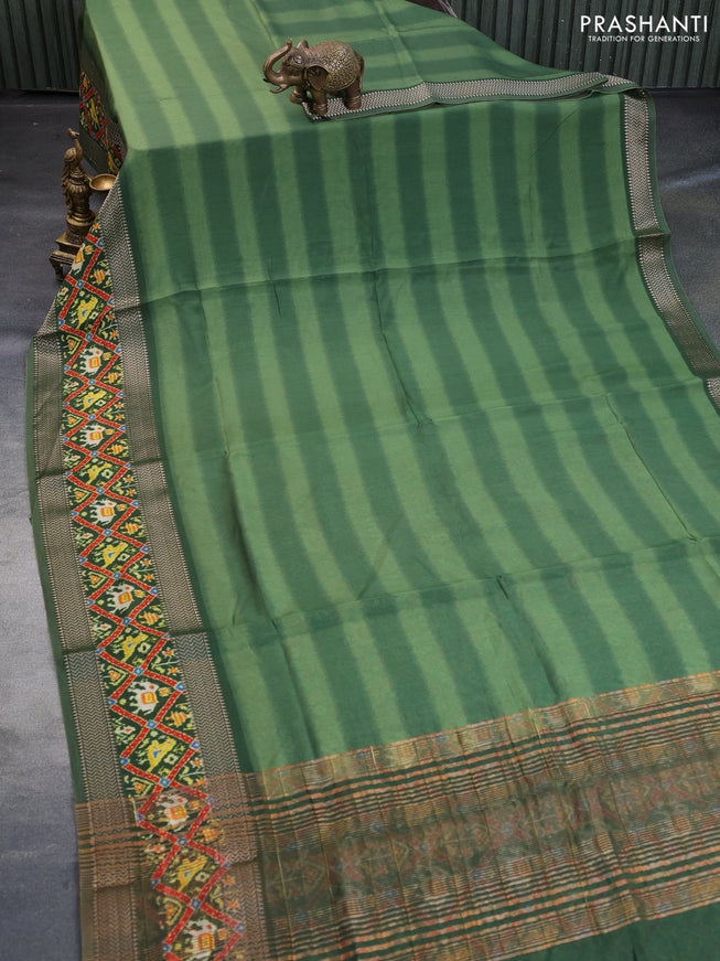 Muslin silk saree green with allover stripes pattern and rettapet zari woven ikat style border