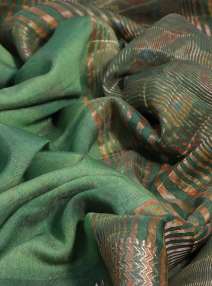 Muslin silk saree green with allover stripes pattern and rettapet zari woven ikat style border