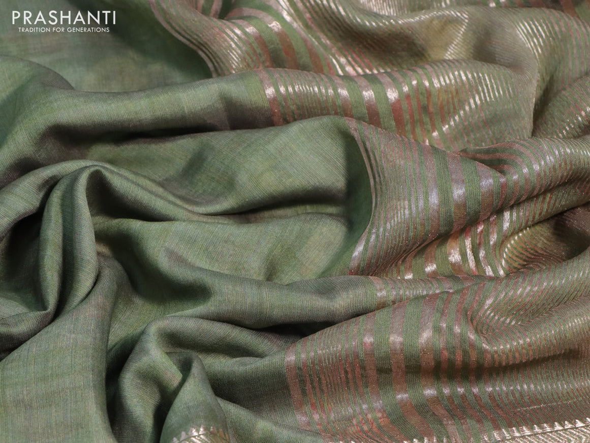 Muslin silk saree green shade and off white with checked pattern and rettapet zari woven printed border