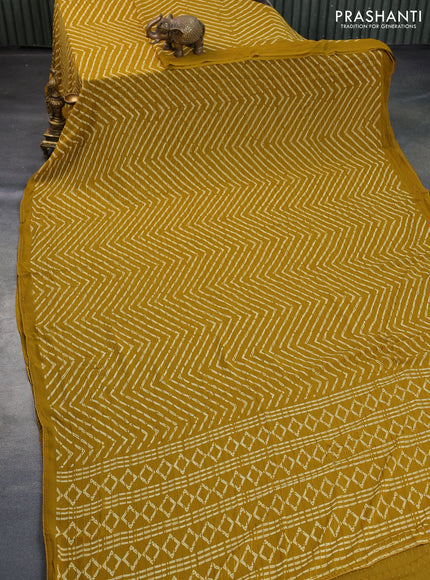 Semi georgette saree mustard yellow with allover prints & sequin work in borderless style