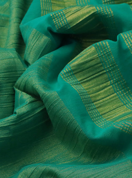 Crushed tissue saree teal green with plain body and paisley zari woven border