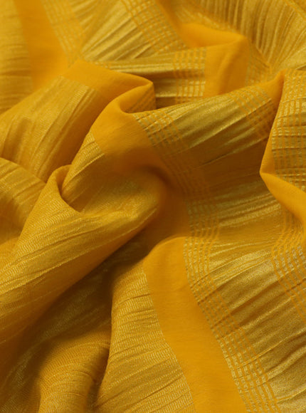 Crushed tissue saree yellow with plain body and paisley zari woven border