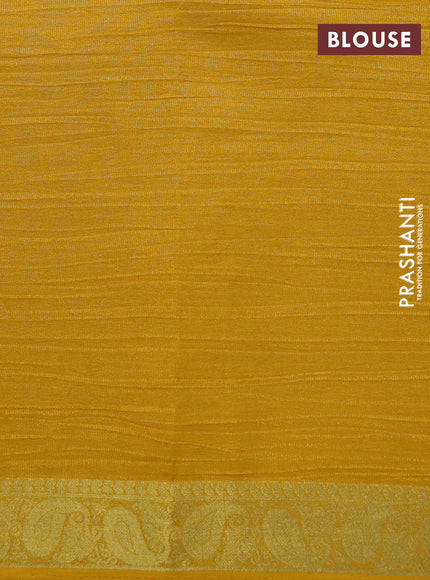 Crushed tissue saree yellow with plain body and paisley zari woven border