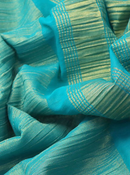 Crushed tissue saree teal blue with plain body and zari woven border