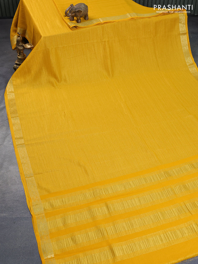 Crushed tissue saree mango yellow with plain body and zari woven border