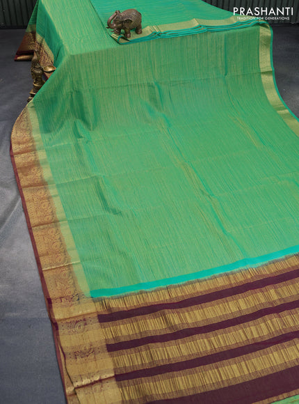 Crushed tissue saree green and wine shade with plain body and zari woven border