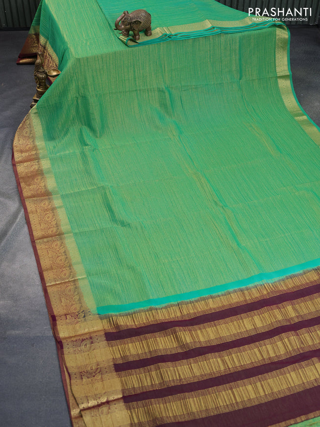 Crushed tissue saree green and wine shade with plain body and zari woven border