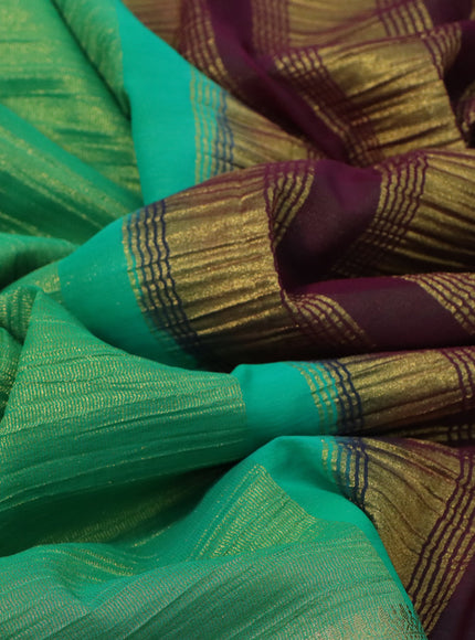 Crushed tissue saree green and wine shade with plain body and zari woven border