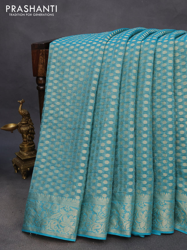 Crushed tissue saree teal blue with allover zari woven buttas and zari woven floral border