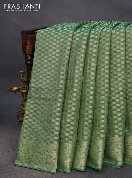 Crushed tissue saree green with allover zari woven buttas and zari woven floral border