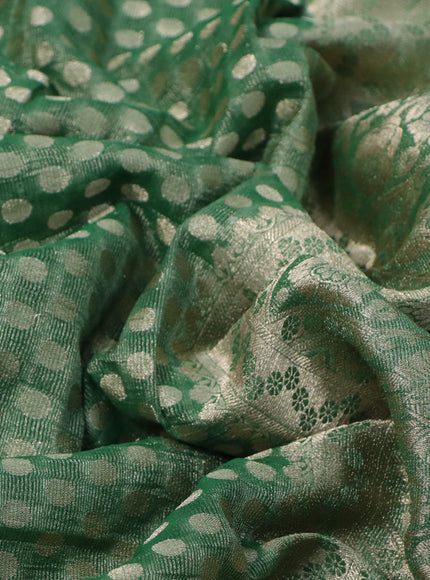 Crushed tissue saree green with allover zari woven buttas and zari woven floral border