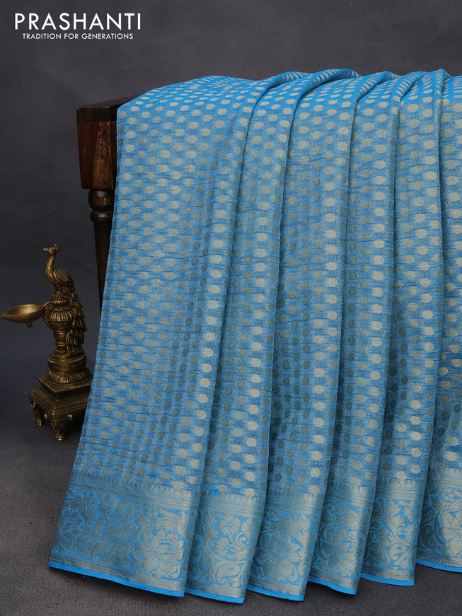 Crushed tissue saree cs blue with allover zari woven buttas and zari woven floral border