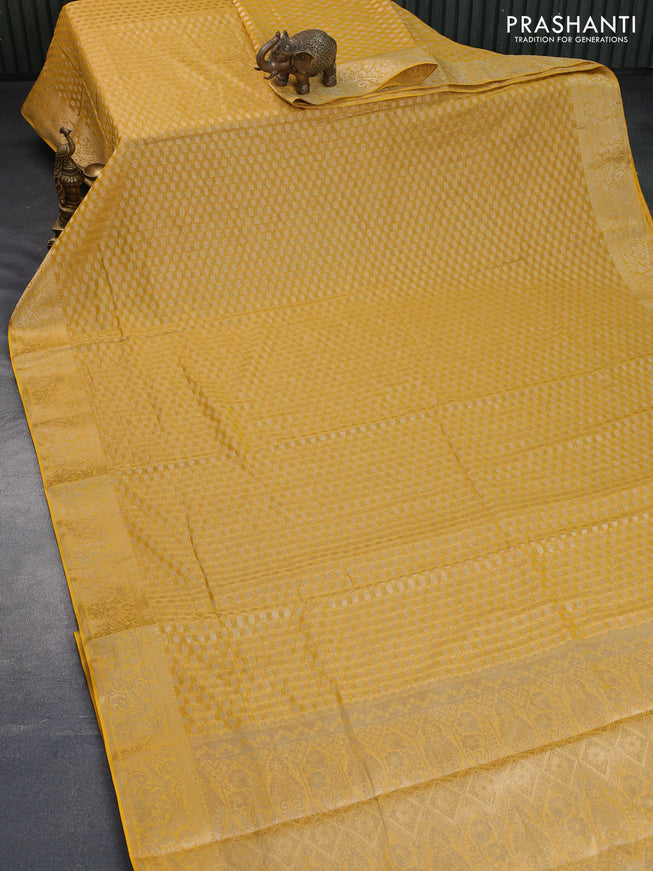 Crushed tissue saree mustard yellow with allover zari woven buttas and zari woven floral border