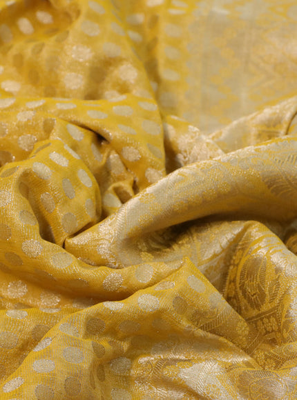 Crushed tissue saree mustard yellow with allover zari woven buttas and zari woven floral border