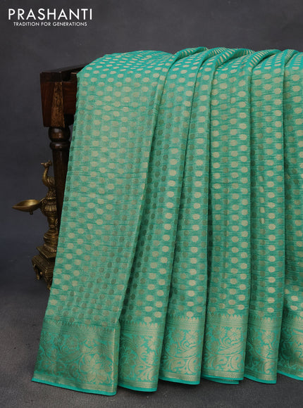 Crushed tissue saree green with allover zari woven buttas and zari woven floral border