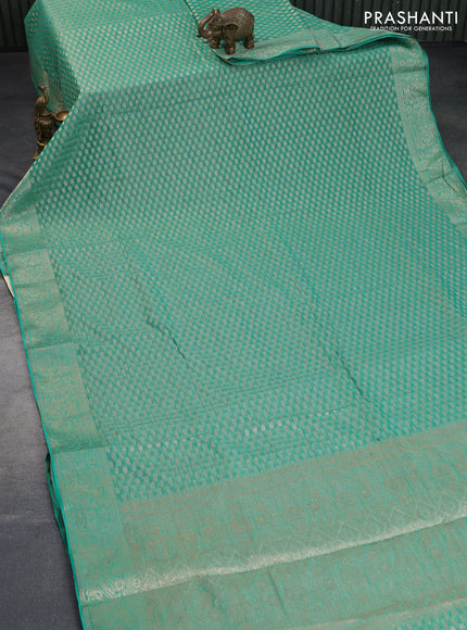 Crushed tissue saree green with allover zari woven buttas and zari woven floral border