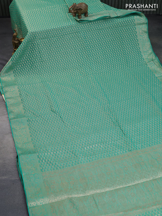 Crushed tissue saree green with allover zari woven buttas and zari woven floral border