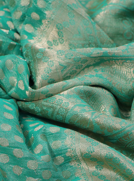 Crushed tissue saree green with allover zari woven buttas and zari woven floral border