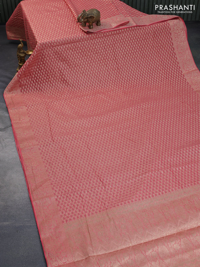 Crushed tissue saree peach pink with allover zari woven buttas and zari woven floral border