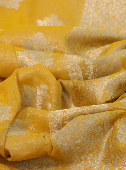 Crushed tissue saree mango yellow with zari woven buttas and zari woven floral border