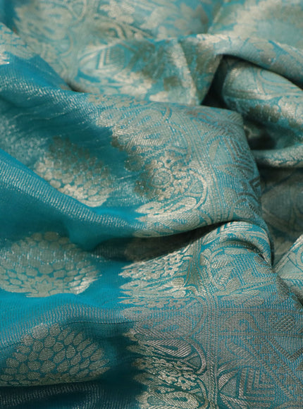 Crushed tissue saree teal blue with zari woven buttas and zari woven floral border