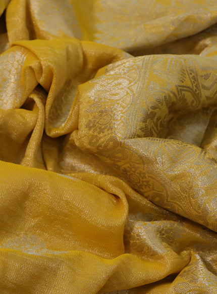 Crushed tissue saree mango yellow with zari woven buttas and zari woven floral border