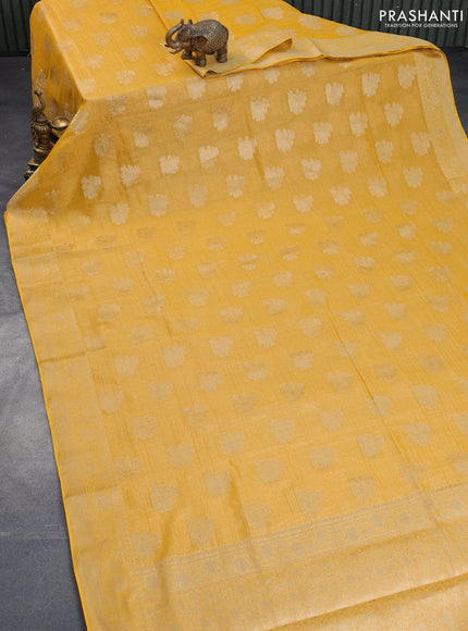 Crushed tissue saree mango yellow with zari woven buttas and zari woven floral border