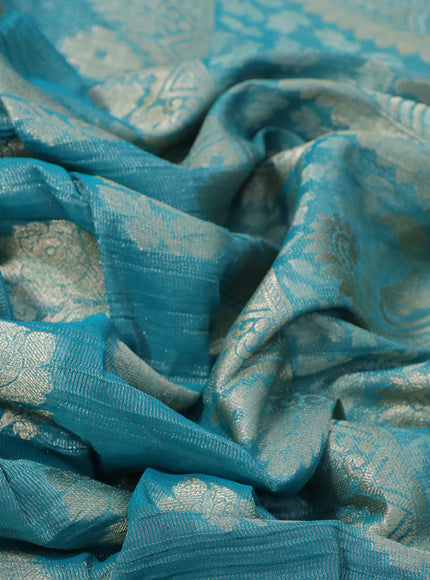 Crushed tissue saree teal blue with zari woven floral buttas and zari woven floral border