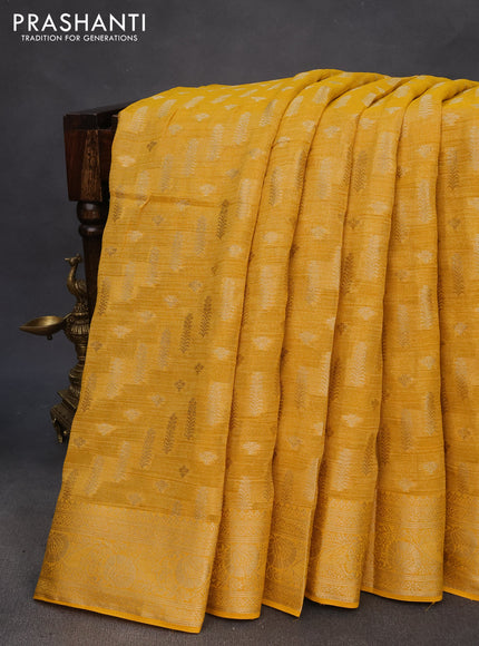 Crushed tissue saree yellow with allover zari woven buttas and zari woven floral border