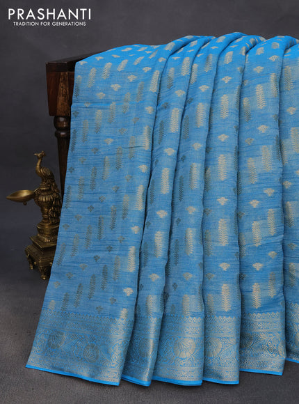 Crushed tissue saree cs blue with allover zari woven buttas and zari woven floral border