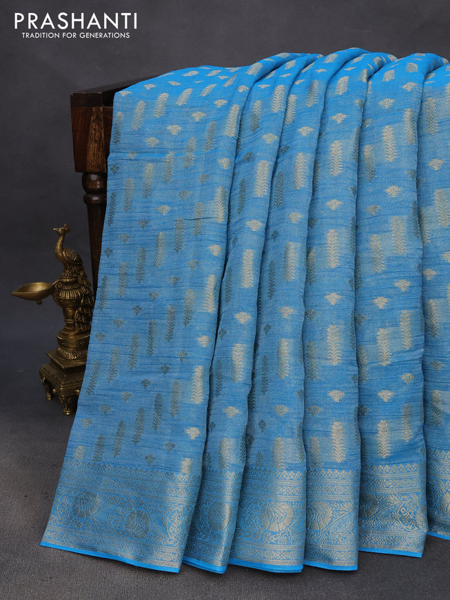 Crushed tissue saree cs blue with allover zari woven buttas and zari woven floral border