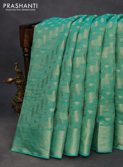 Crushed tissue saree teal green with allover zari woven buttas and zari woven floral border