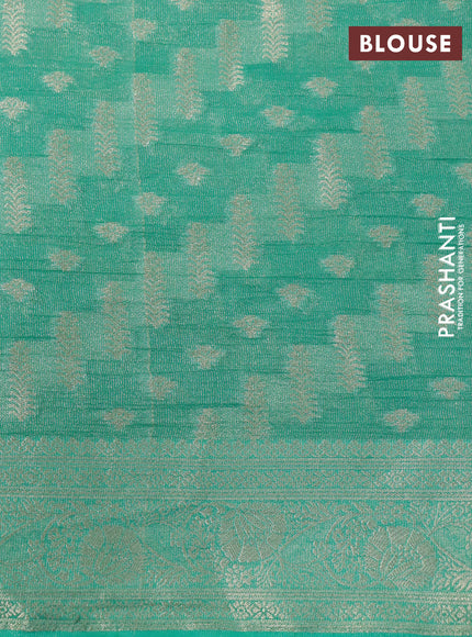 Crushed tissue saree teal green with allover zari woven buttas and zari woven floral border