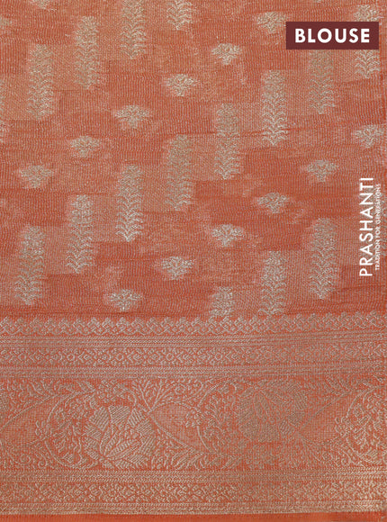 Crushed tissue saree orange with allover zari woven buttas and zari woven floral border