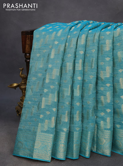 Crushed tissue saree teal blue with allover zari woven buttas and zari woven floral border