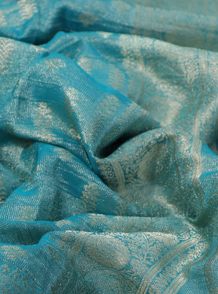 Crushed tissue saree teal blue with allover zari woven buttas and zari woven floral border