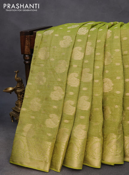 Crushed tissue saree light green with allover zari woven buttas and zari woven border