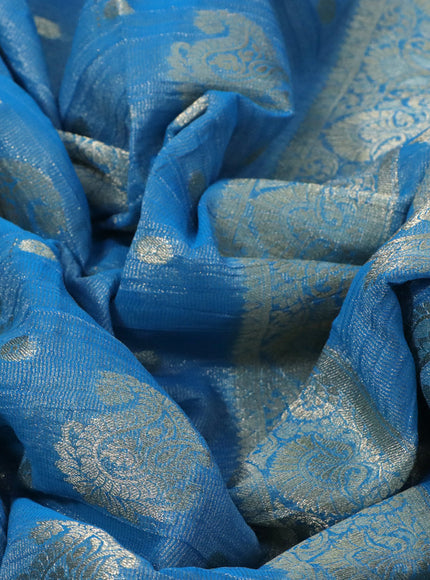 Crushed tissue saree cs blue with allover zari woven buttas and zari woven border